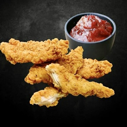 Стрипсы куриные в панировке с/м 1 кг ТМ Атлантис(опт 467 руб/кг)